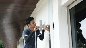 Air conditioning technician installing wiring work